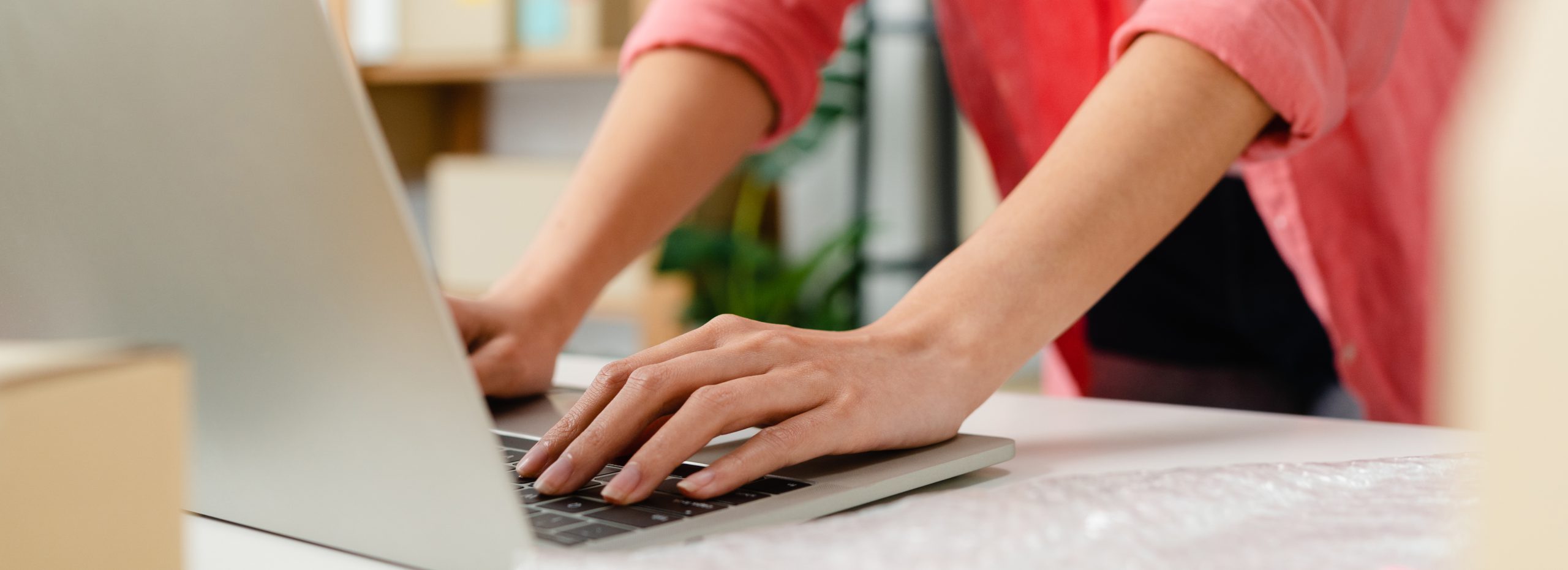 Person typing on laptop